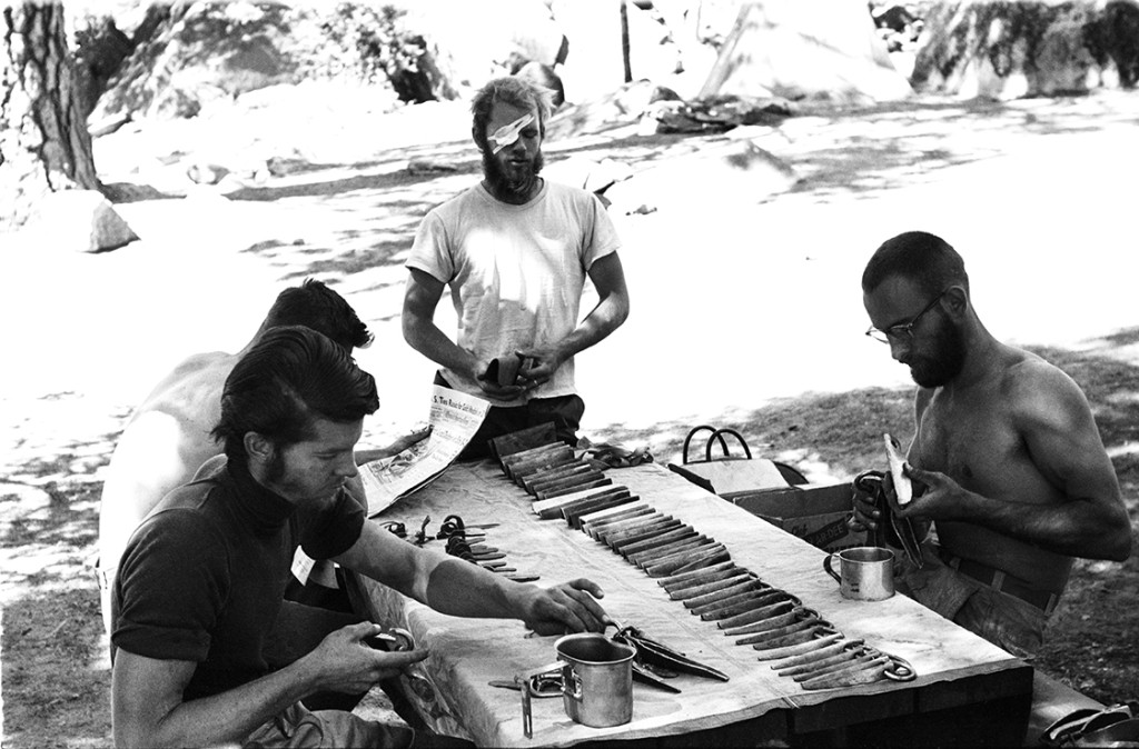 Climbers organizing climbing gear on a table in Yosemite NP, California (Historic Image).
